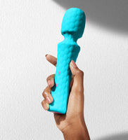 elegant wand vibrator in hand